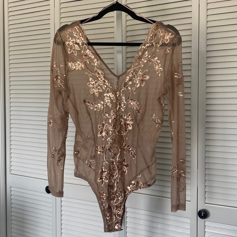 Long sleeved, embellished mesh body suit